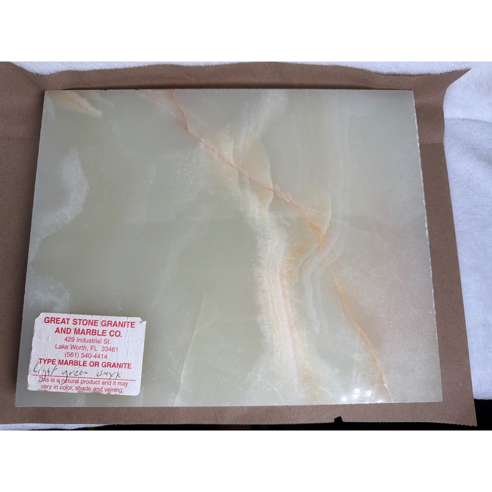 Natural light green onyx featuring soft white and warm amber veining. Tile 11x9